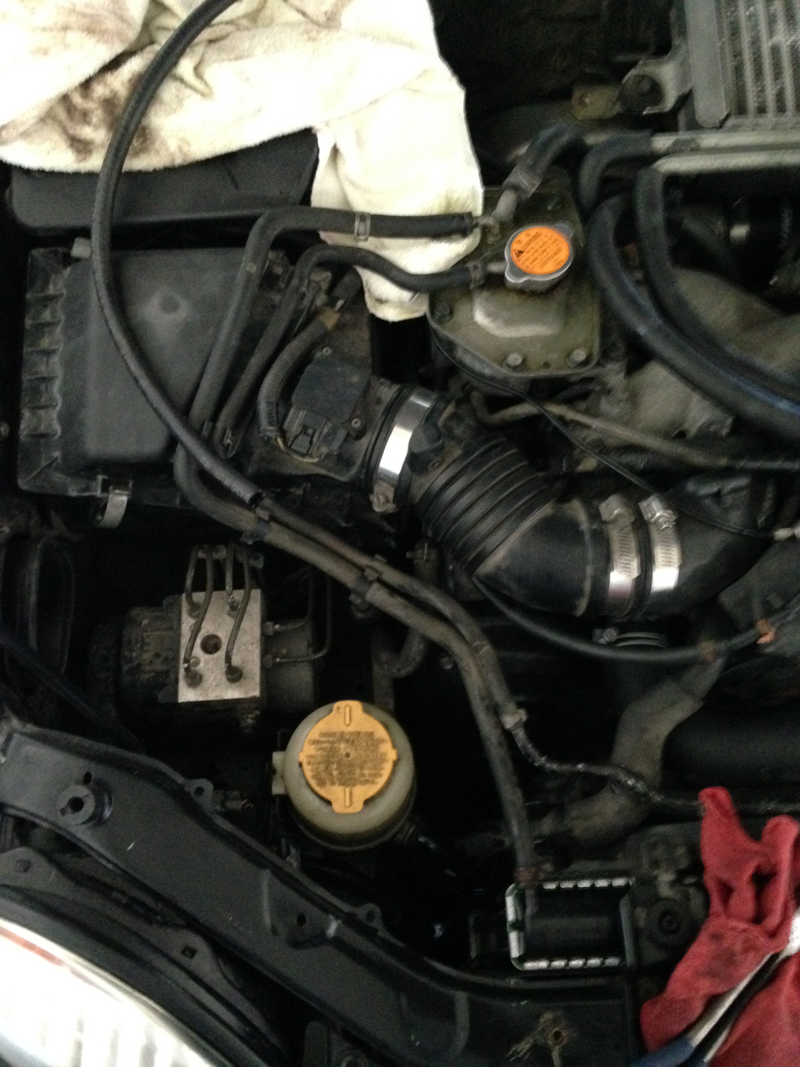 hose just off the reservoir cap was spraying fluid dead ahead at the radiator.